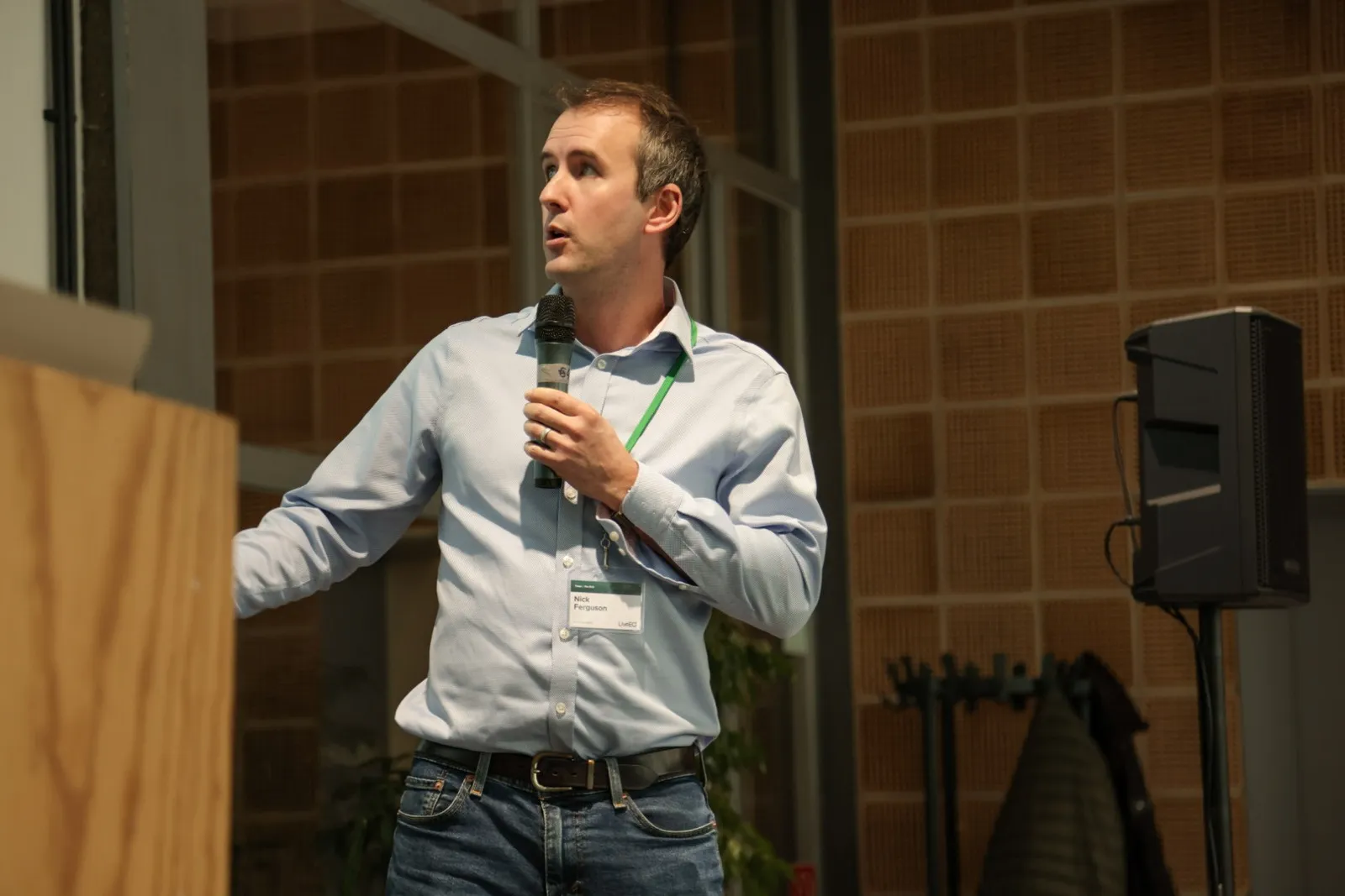 A speaker at the lectern with a microphone