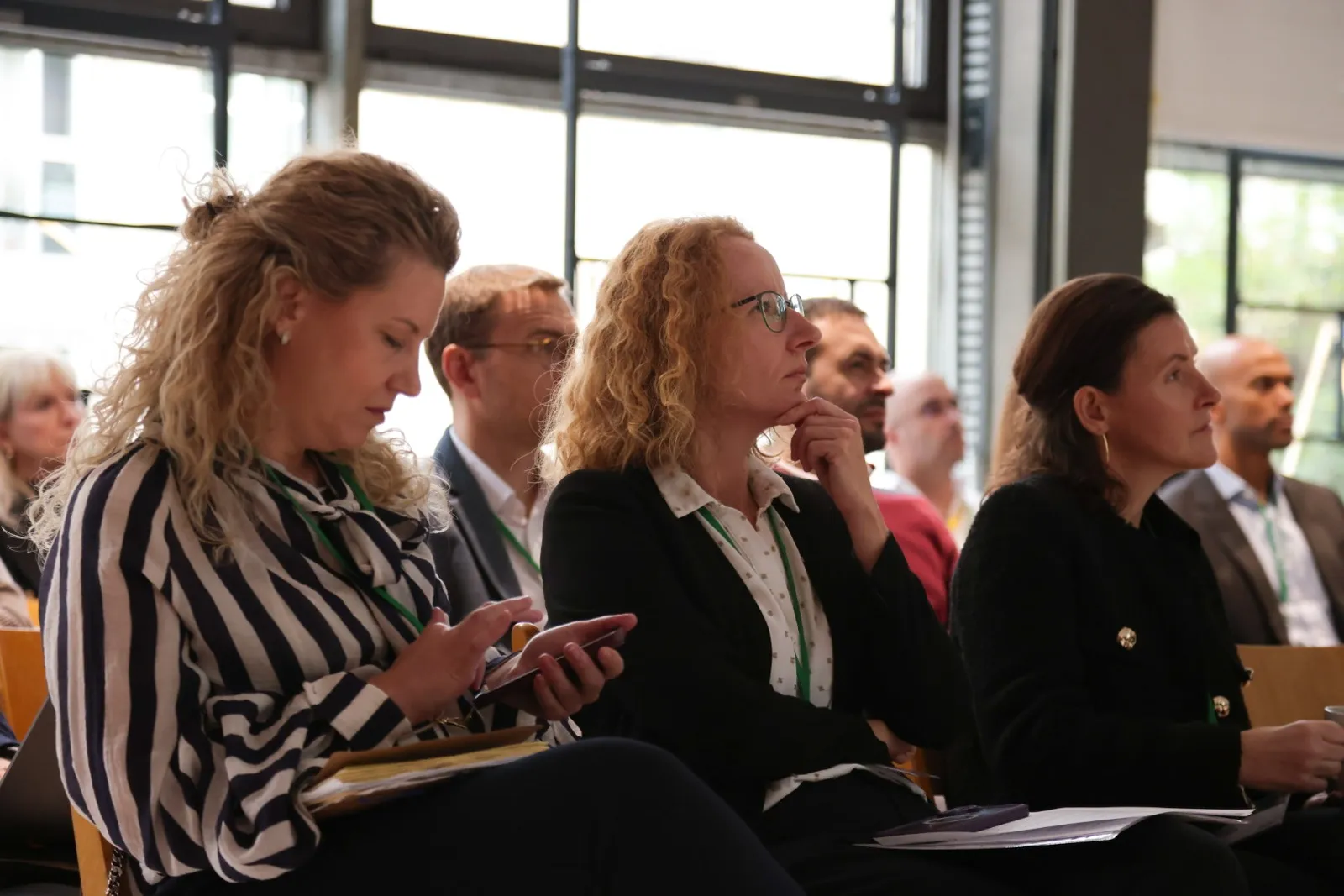Participants listening and taking notes during a case study at the 2026 forum