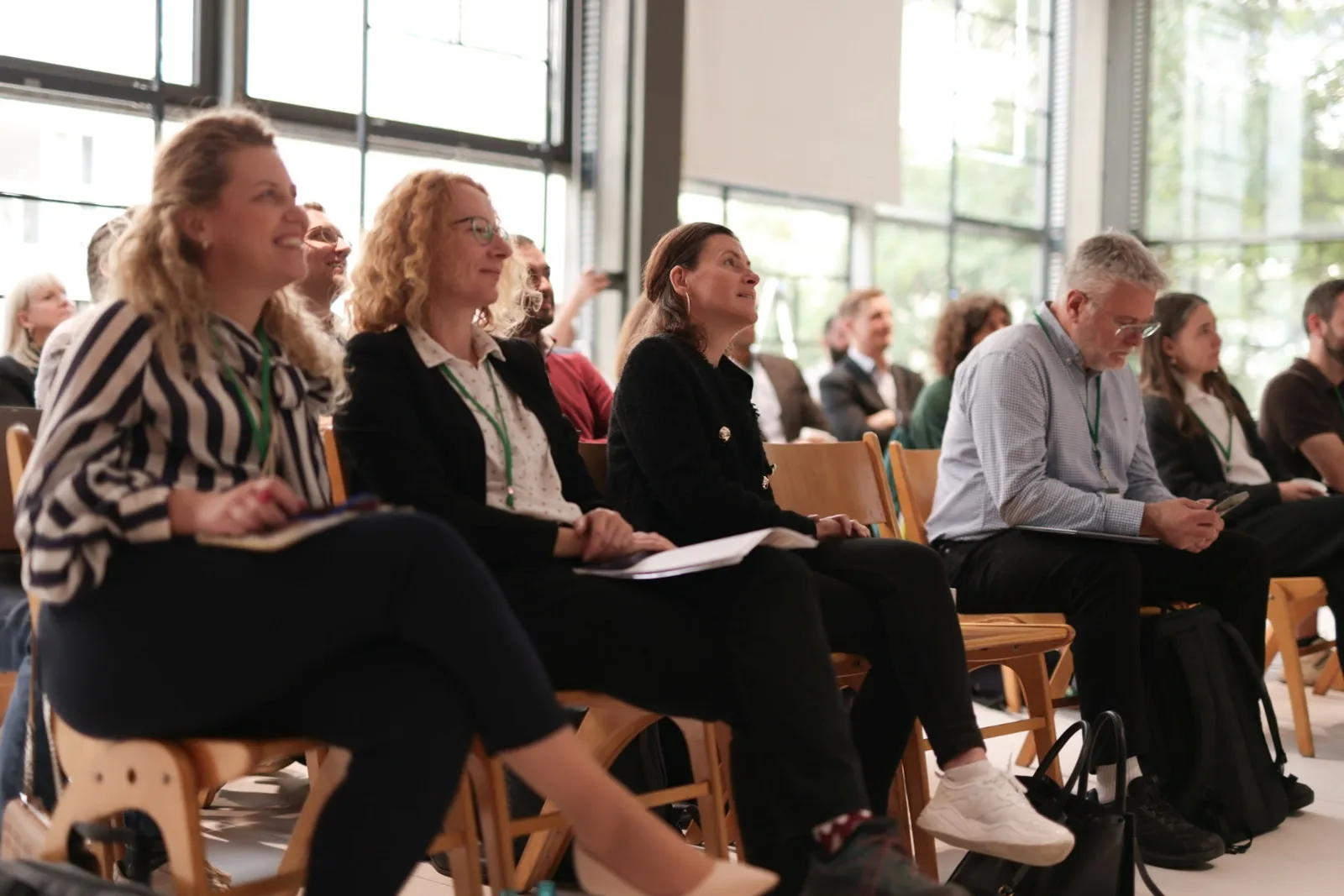 Participants in the front rows laughing during a session at the 2026 forum