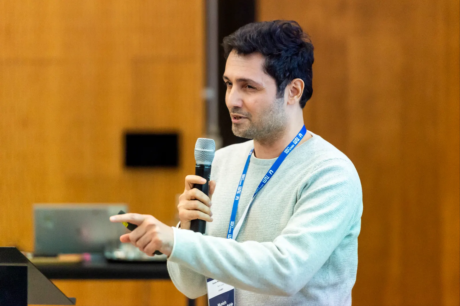 A speaker taking questions from the room